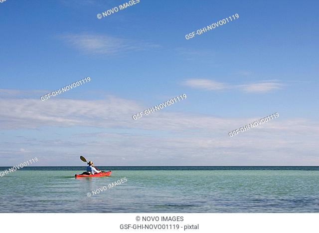 Man Kayaking on Ocean, Florida Keys, USA