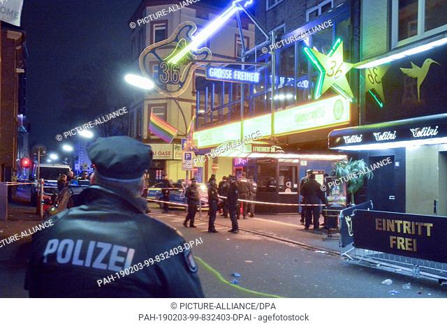 FILED - 03 February 2019, Hamburg, Hambühren: Policemen secure the crime scene on the Great Freedom. Two people were injured in an incident in Hamburg's St
