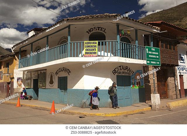 Local people in front of the colonial houses at the town center, Pisac, Sacred Valley, Cusco Region, Peru, South America