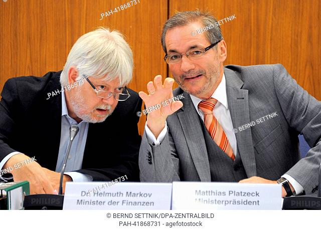 Premier of Brandenburg Matthias Platzeck (SPD, R) talks to Brandenburg Minister of Finance Helmut Markov (Left Party) before the start of a session of the...
