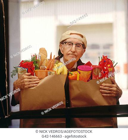 Elderly man with groceries
