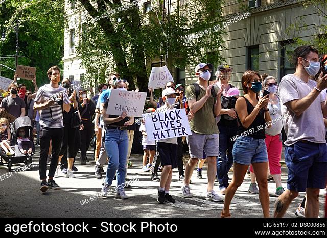 Protest marchers on the Harlem Families Black Lives Matter march in Harlem, New York City