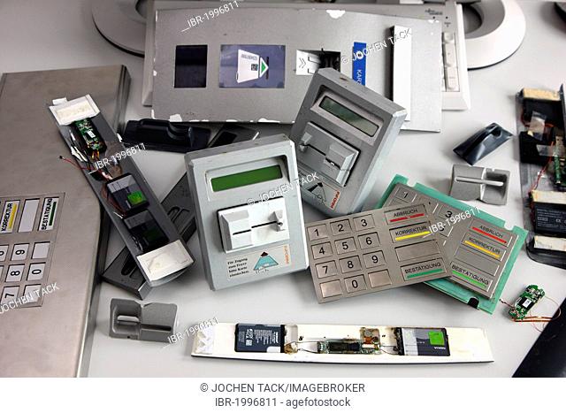 Seized equipment for skimming, tampering with ATMs, fake keyboards, card readers, cameras to record PINs, presented at a press conference on cyber-crime of the...