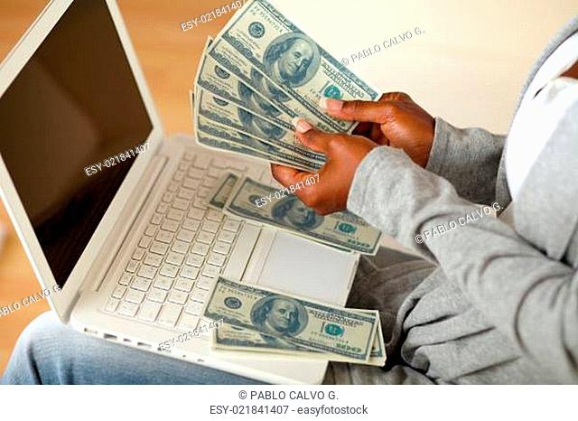 Black woman counting plenty of cash money