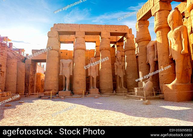 Statues of pharaoh in Karnak temple of Luxor at sunrise