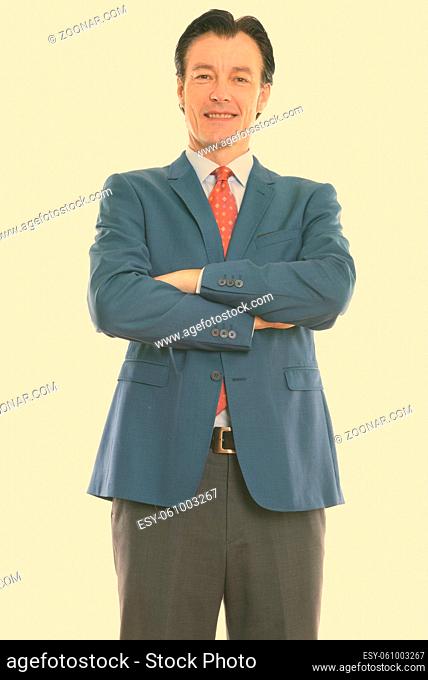 Studio shot of mature handsome man isolated against white background