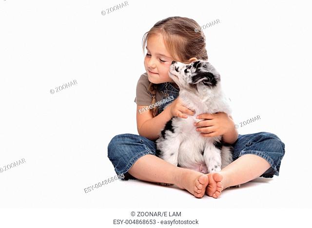 little girl and a puppy