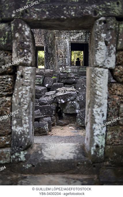 A female tourist in her visit of the View of the Preah Khan temple in the Angkor Wat Historical Site, Siem Reap, Cambodia