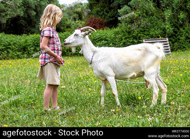 Girl with goat, Corfu, Greece, Europe