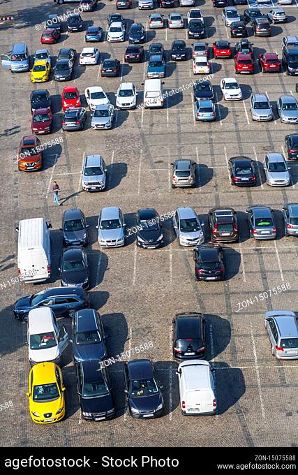 Big parking with lot of different cars seen from above