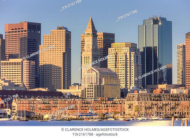 Early morning light reflects off the Custom House Tower, skyscrapers in the Financial District, and low rise wharves on the waterfront which make up part of the...