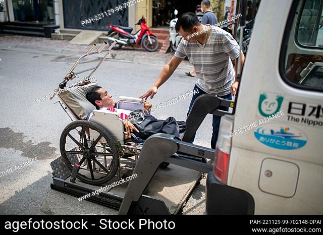 PRODUCTION - 06 October 2022, Vietnam, Hanoi: Dinh Quoc Tuan has cerebral palsy and needs a special transporter with a motorized ramp to travel long distances...