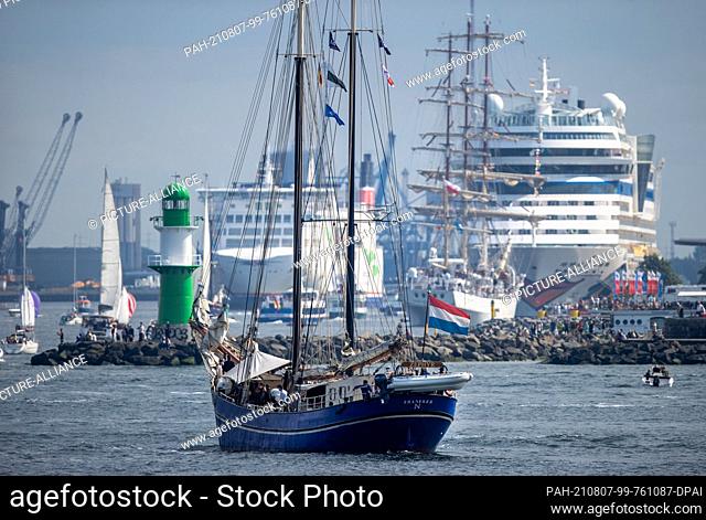 07 August 2021, Mecklenburg-Western Pomerania, Rostock: The schooner ""Zephyr"" from the Netherlands is sailing towards the sea canal where many sailing boats...