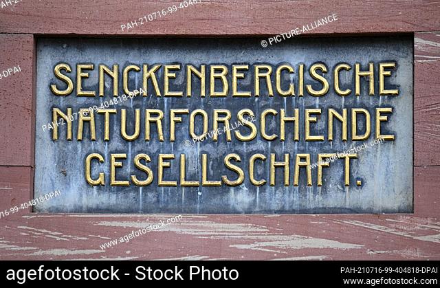 PRODUCTION - 09 July 2021, Hessen, Frankfurt/Main: A plate with the inscription ""Senckenbergische Naturforschende Gesellschaft"" is embedded in the facade at...