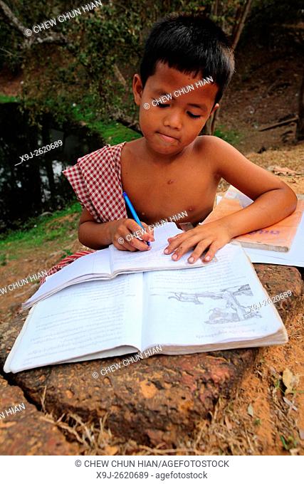 Boy studying, Cambodia