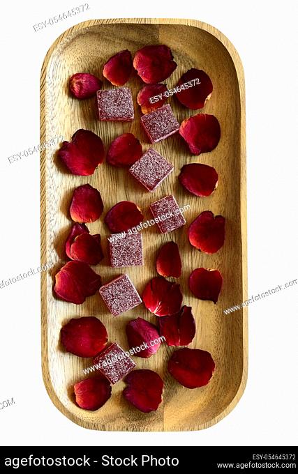 cranberry marmalade and rose petals on wooden tray