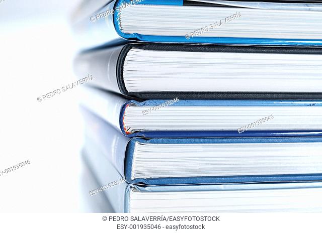 forefront of a group of books stacked