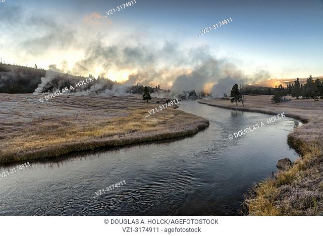 Sunrise over Thermal Activity on a Clear Frosty Fall morning on Freehole River Yellowstone National Park Wyoming USA
