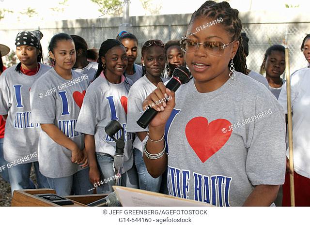 Clean up volunteers, Edison High School students, Black female, local celebrity speaker. Little Haiti. Miami. Florida. USA