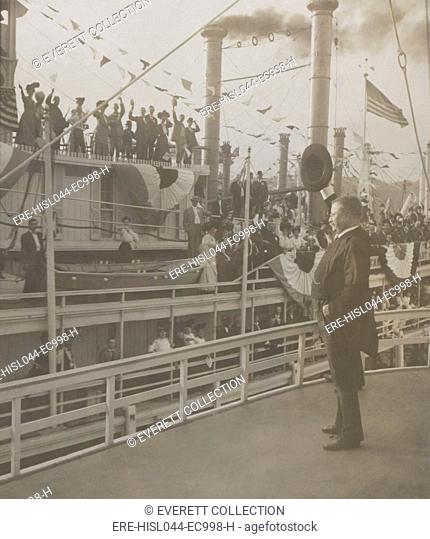 Theodore Roosevelt waving to passengers on another ship, from the deck of the SS Mississippi. Saint Louis, Missouri, Oct. 2, 1907