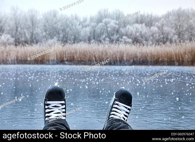 Ice skating on frozen lake