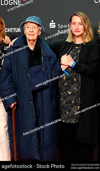 23 October 2023, North Rhine-Westphalia, Cologne: Actress Ilse Strambowski and Merle Wasmuth, l-r, arrives at the screening of the film ""Eher fliegen hier...