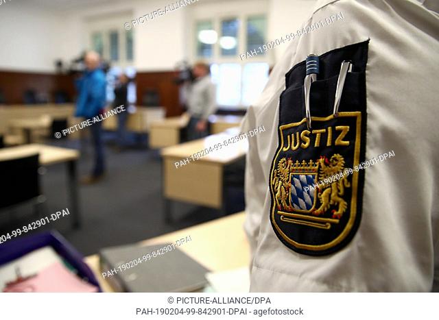 04 February 2019, Bavaria, Nürnberg: At the beginning of the trial, a justice official stands in the courtroom of the Nuremberg-Fürth Regional Court