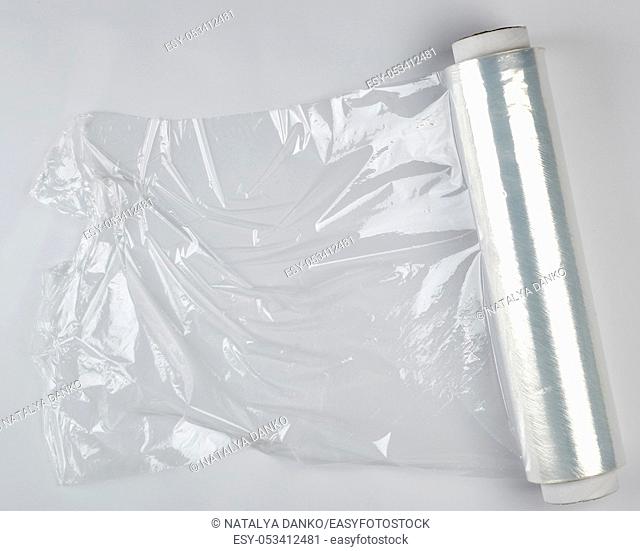 big roll of wound white transparent film for wrapping food, top view
