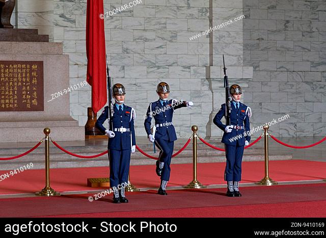Taipei, Taiwan - January 08, 2015: Changing of guards procession inside Chiang Kai-Shek memorial hall