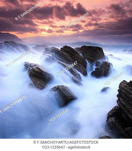 Waves breaking against the coast in Cerdigo, Castro Urdiales, Cantabria, Spain