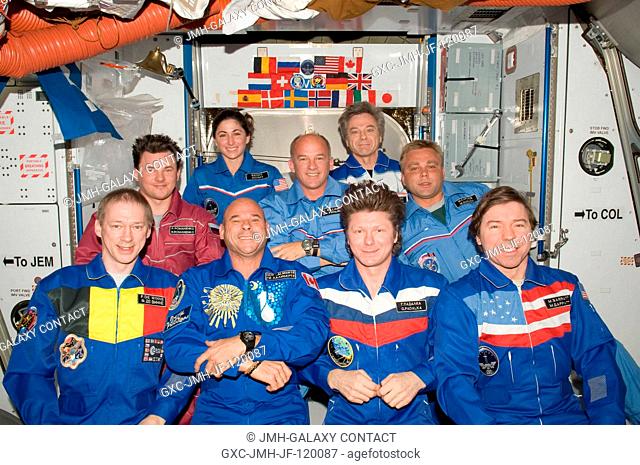 Crew members on the International Space Station pose for a group photo following a joint crew news conference in the Harmony node of the International Space...