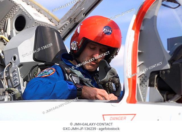 Astronaut John M. Grunsfeld, STS-109 payload commander, photographed in the rear station of a T-38 trainer jet, prepares for a flight at Ellington Field near...