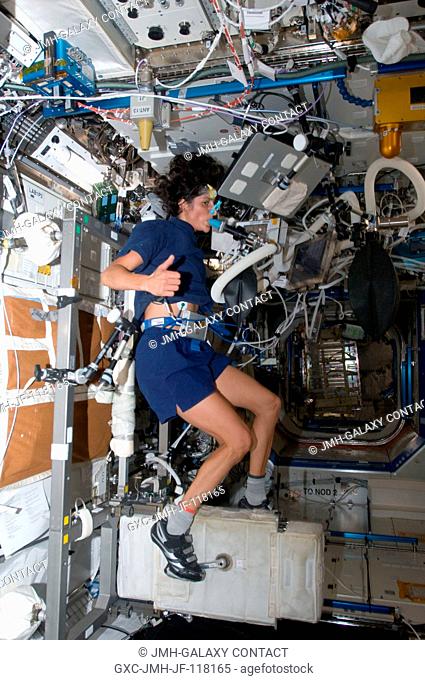 NASA astronaut Sunita Williams, Expedition 32 flight engineer, performs a VO2max experiment while using the Cycle Ergometer with Vibration Isolation System...