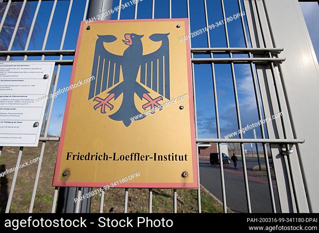 12 March 2020, Mecklenburg-Western Pomerania, Riems: A sign with a federal eagle hangs in the entrance area of the Friedrich-Loeffler-Institute for Animal...