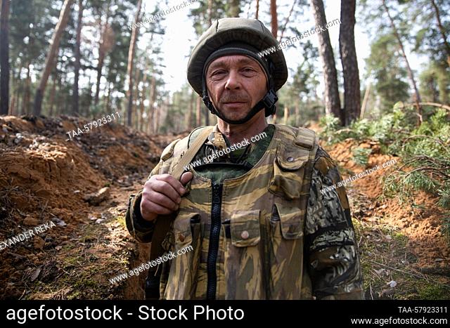 RUSSIA, LUGANSK PEOPLE'S REPUBLIC - MARCH 17, 2023: A volunteer from the Chita Region (nom de guerre Buran), member of the BARS-13 Russky Mir volunteer...