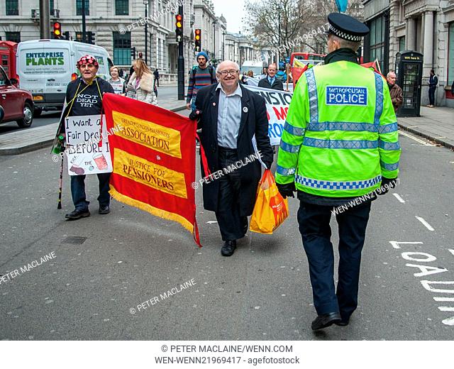 Old age pensioners and disabled people protesting outside the Institute of Directors on Pall Mall and outside the offices Energy UK on Lower Regent Street where...