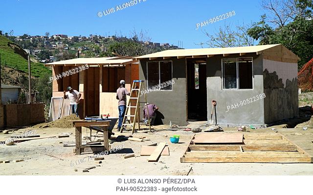 FILE - A file picture dated 08 March 2017 shows Haitian migrants building a hut near Tijuana, Mexico. Thousands of Haitians were forced to remain in the mexican...