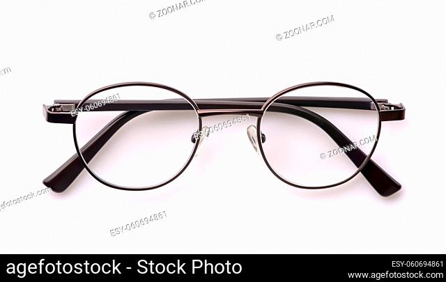 Folded classic eyeglasses isolated on white