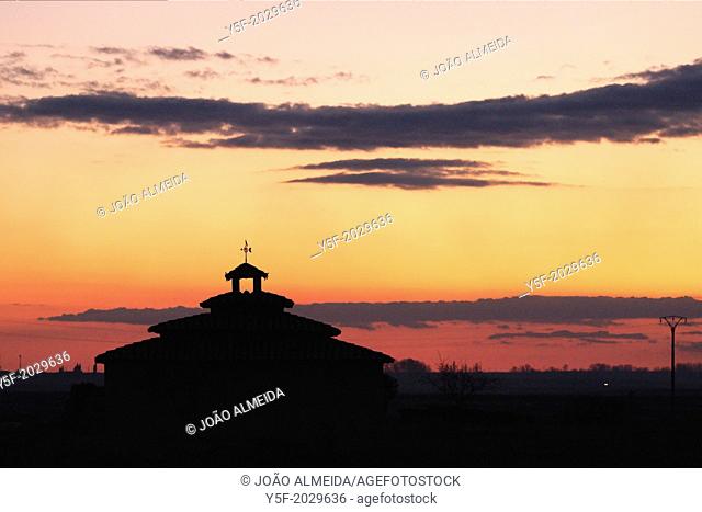 Silhouette of dovecote by sunset at Otero de Sariegos