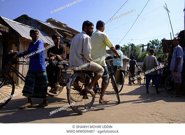 Mr Ahad Ali Shaikh ferries a passenger with his 'helicopter' A Bangladeshi 'helicopter' is a bicycle-taxi with a seat at the back covered with foam or wood for...