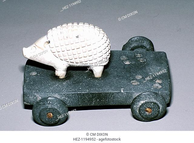Calcite and bitumen hedgehog mounted on wheeled base, Susa, c12th century BC. This object was part of a hoard deposited near the Temple of Inshushinak (the...