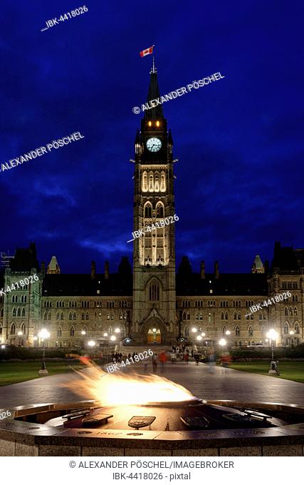Parliament with symbolic flame, Centennial Flame, Parliament Hill, night scene, Ottawa, Ontario Province, Canada
