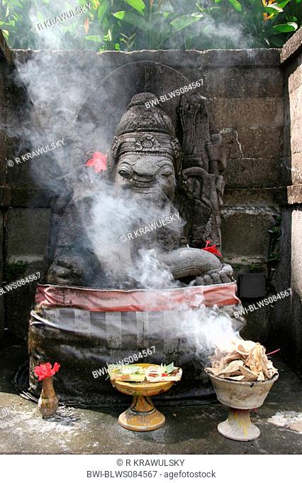 smoke oblation at a Ganesha-sculpture, Indonesia, Bali, Ubud