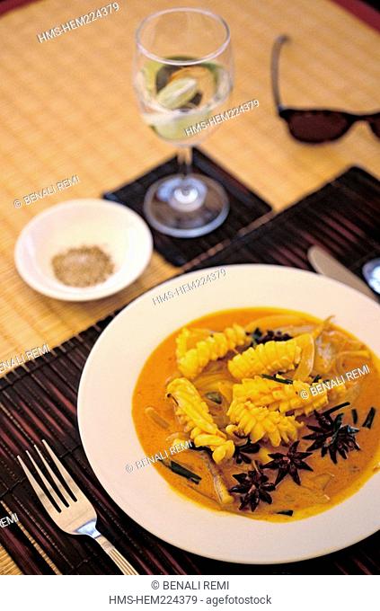 Cambodia, calamari in a coconut curry sauce topped with star anise served on board the Toum Teav cruise boat sailing the Mekong River