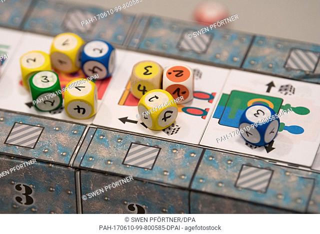Dices can be seen on top of the board game ""Schrottboter"" at the Board game authors meeting in Goettingen, Germany, 10 June 2017