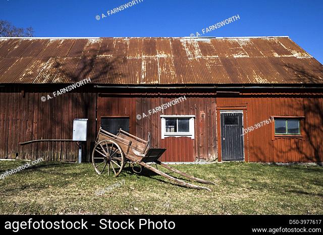 Fengerfors, Sweden A red wooden barn and old carriage