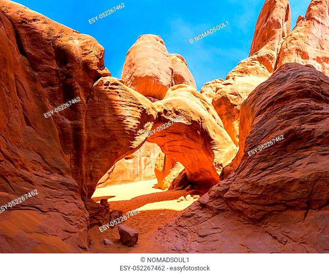 Scenic Landscape Arch between red rocky mountains in Arches National Park, Utah USA