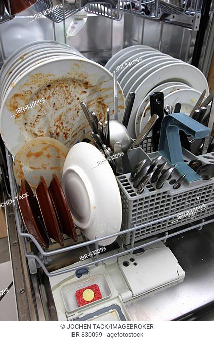 Dishwasher full of dirty dishes