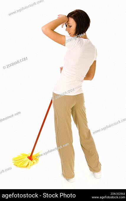 Young woman standing with mop. She's looks like exhausted. Whole body. Rear view. White background