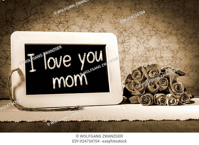 Image of a slate blackboard with message I Love you mom and roses in sepia color